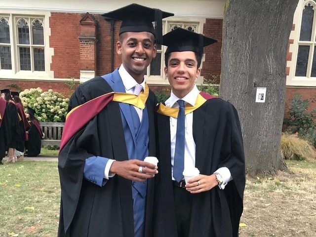 Photo of Jay Lycurgo with his friend on the ocassion of his graduation day with wearing black coat and hat with white shirt and blue tie.
